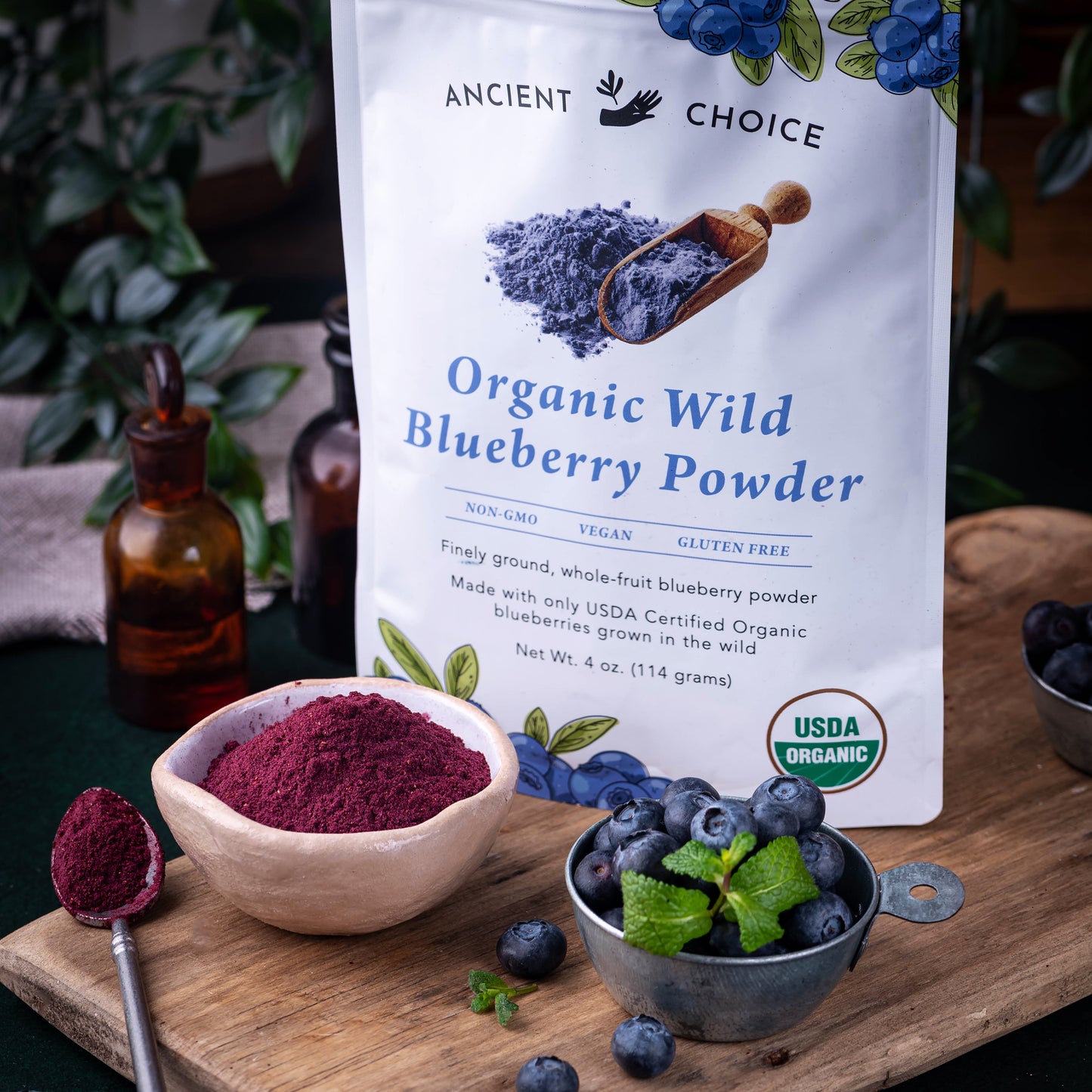 Ancient Choice Wild Blueberry Powder pouch displayed with fresh berries and a small bowl of powder.