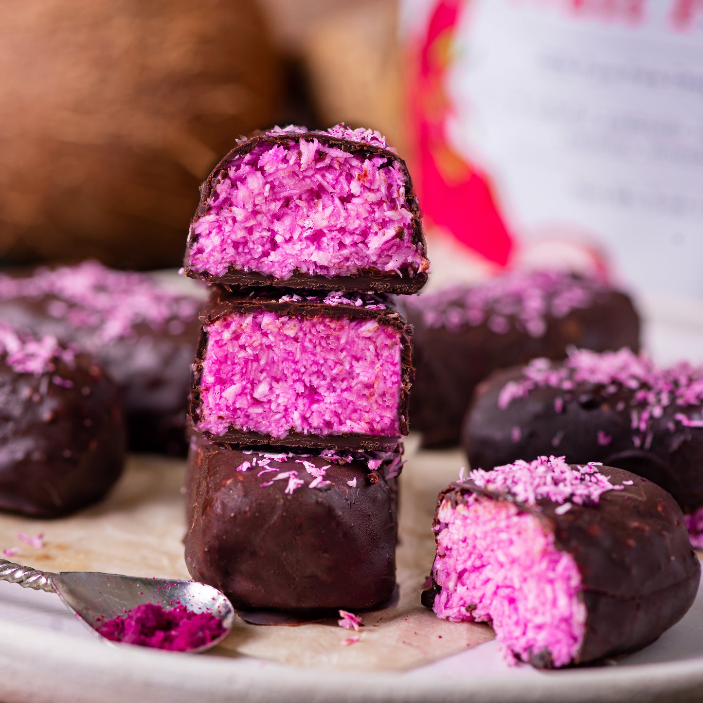 Bounty bars made with Ancient Choice Dragon Fruit Powder, covered with chocolate and filled with coconut.